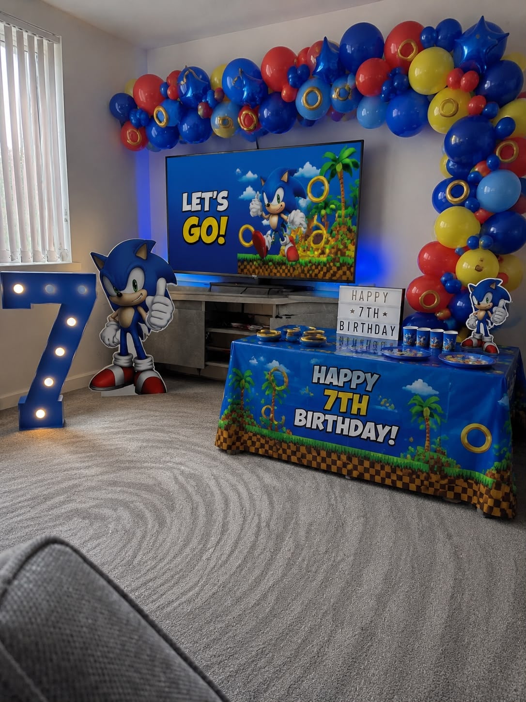 Sonic themed children's birthday party with balloon garland and decor